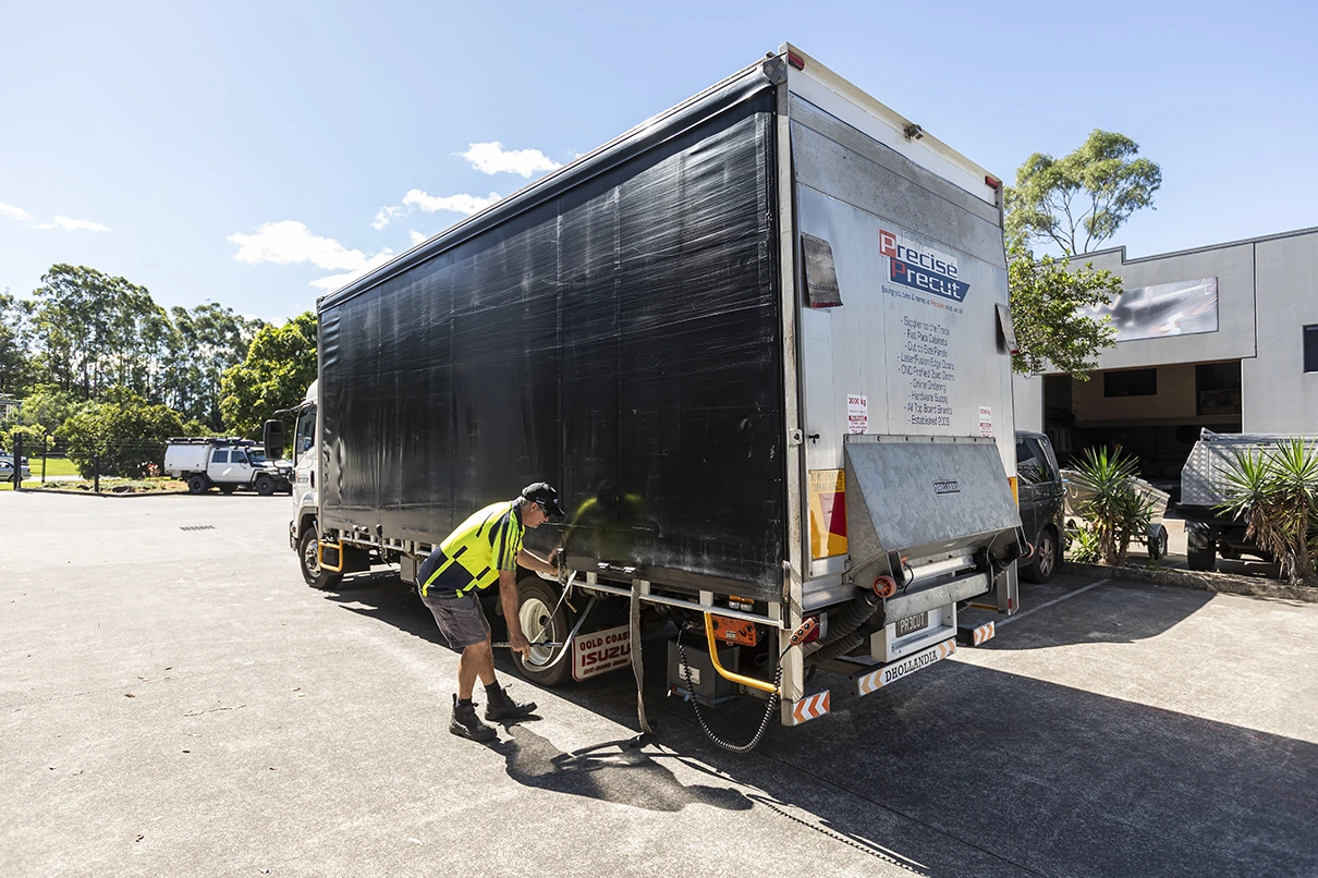 Main delivery truck with tail lift in action